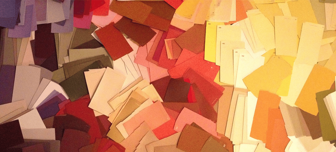 How To Control Color Opacity With RGBA in CSS. hundreds of paint swatches laid out in a messy gradient from dark purple to red to orange to yellow