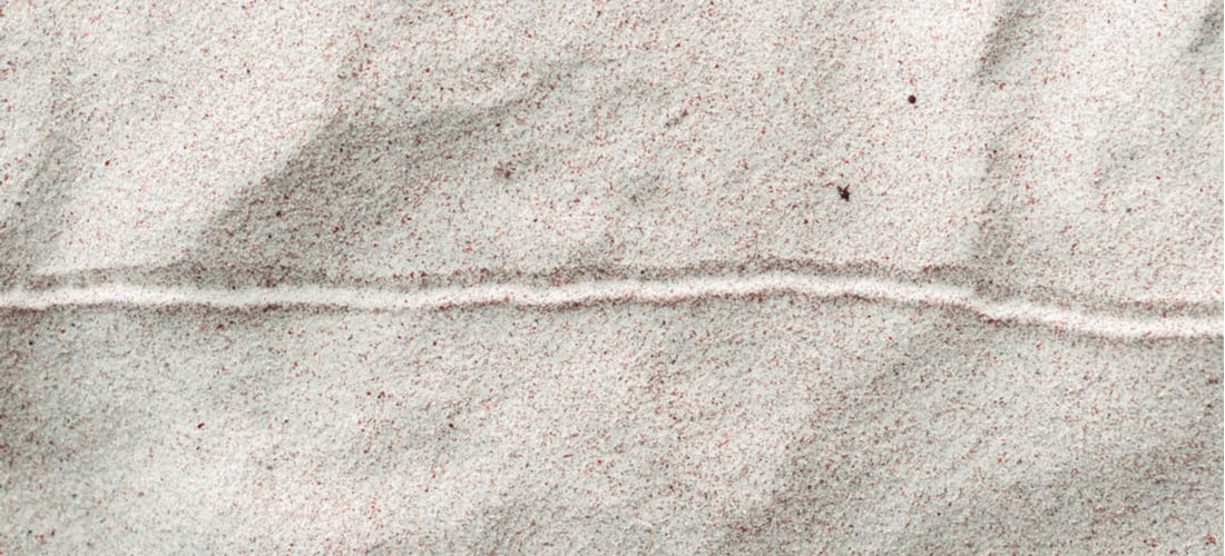 Image of a horizontal line drawn in the sand