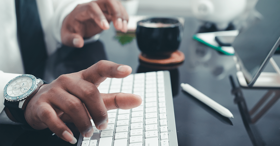 a man at a desk points to something that inspires him