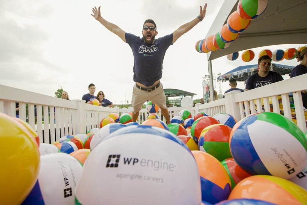 WP Engine employee jumps into a pit of beach balls