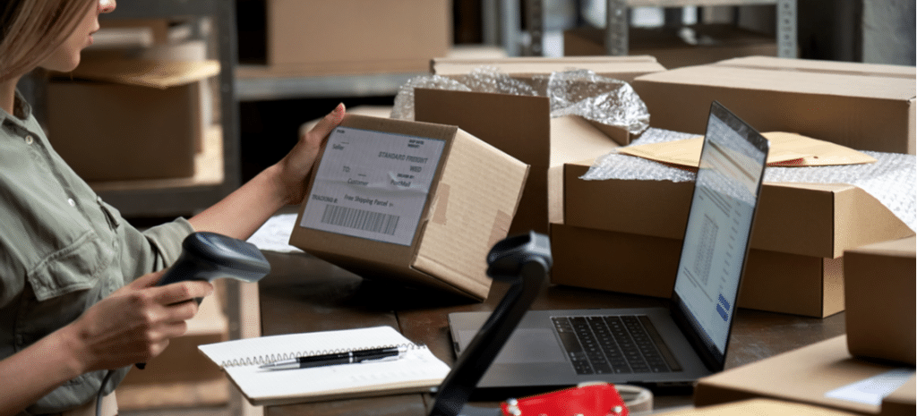 eCommerce store owner scanning packages