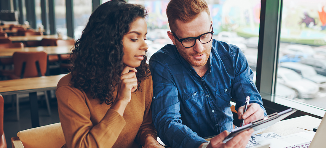two people check personalized website experiences on a laptop and tablet