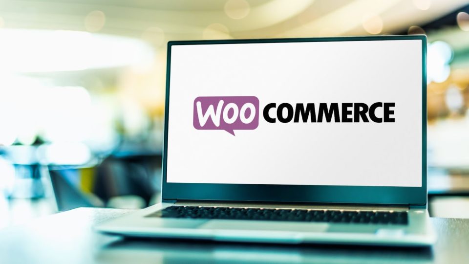 WooCommerce logo on laptop screen